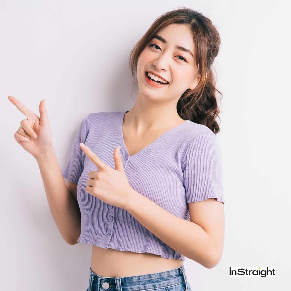 lady showing How to Style Curtain Bangs with a Flat Iron